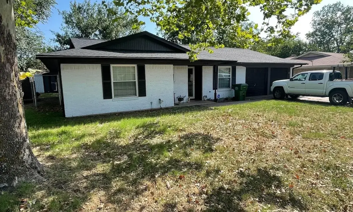 Professional roofing crew working on a residential roof in Raceland